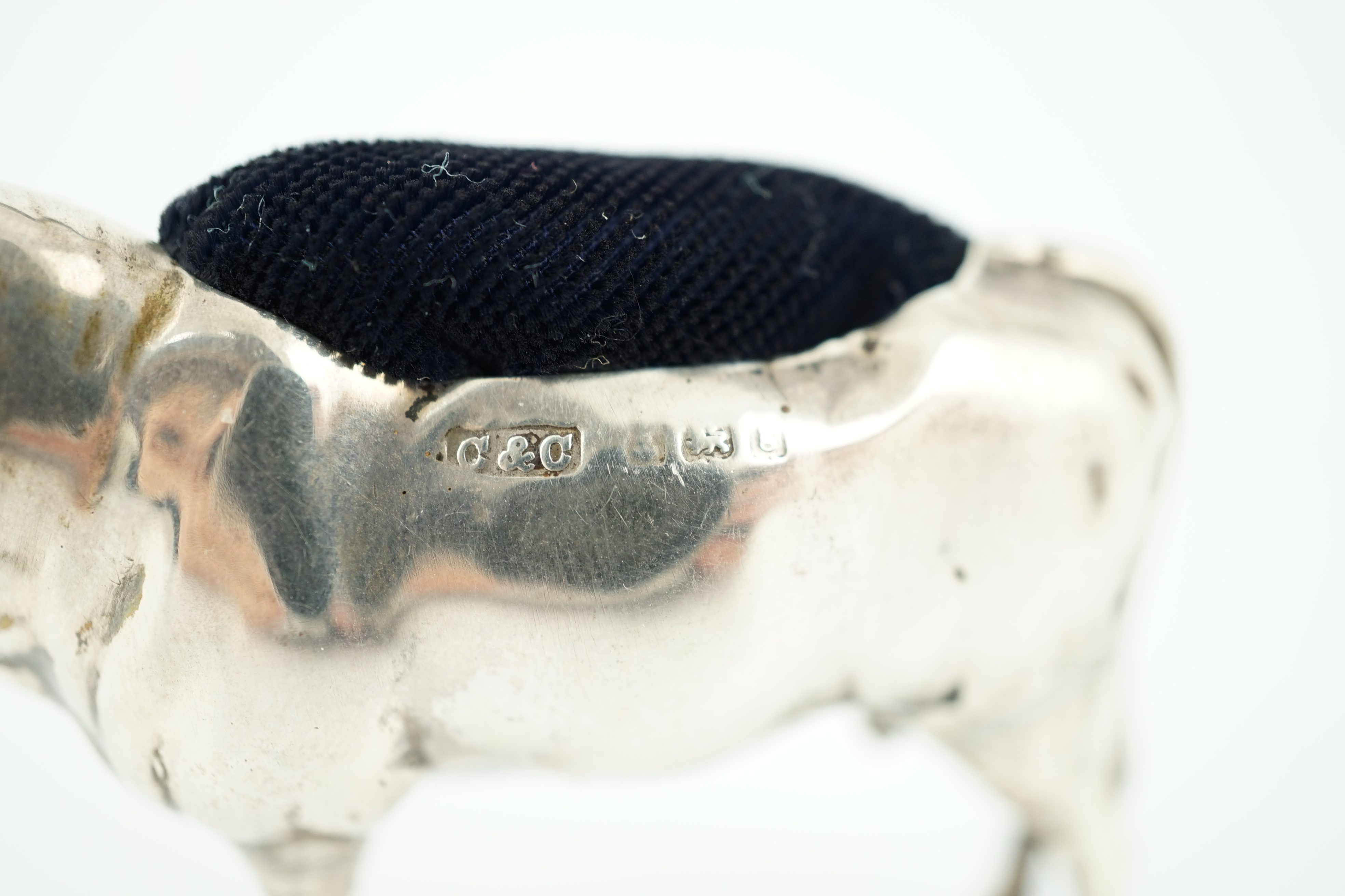 An Edwardian novelty silver pin cushion, modelled as a bull, Cohen & Charles